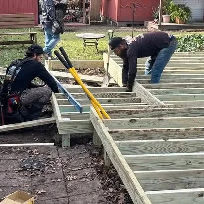 Deck construction with pressure-treated wood joists and framing installation
