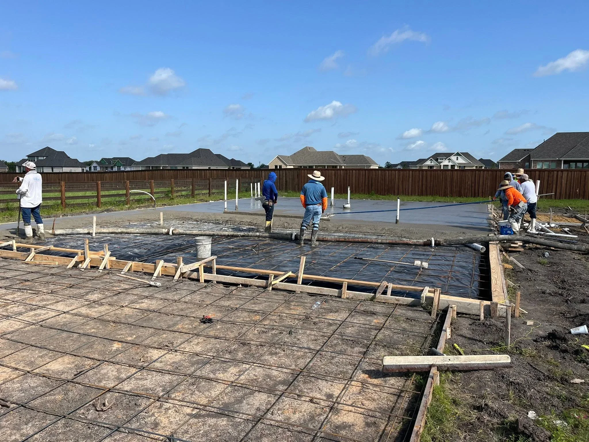 Concrete foundation pour with rebar reinforcement and wooden forms on residential lot